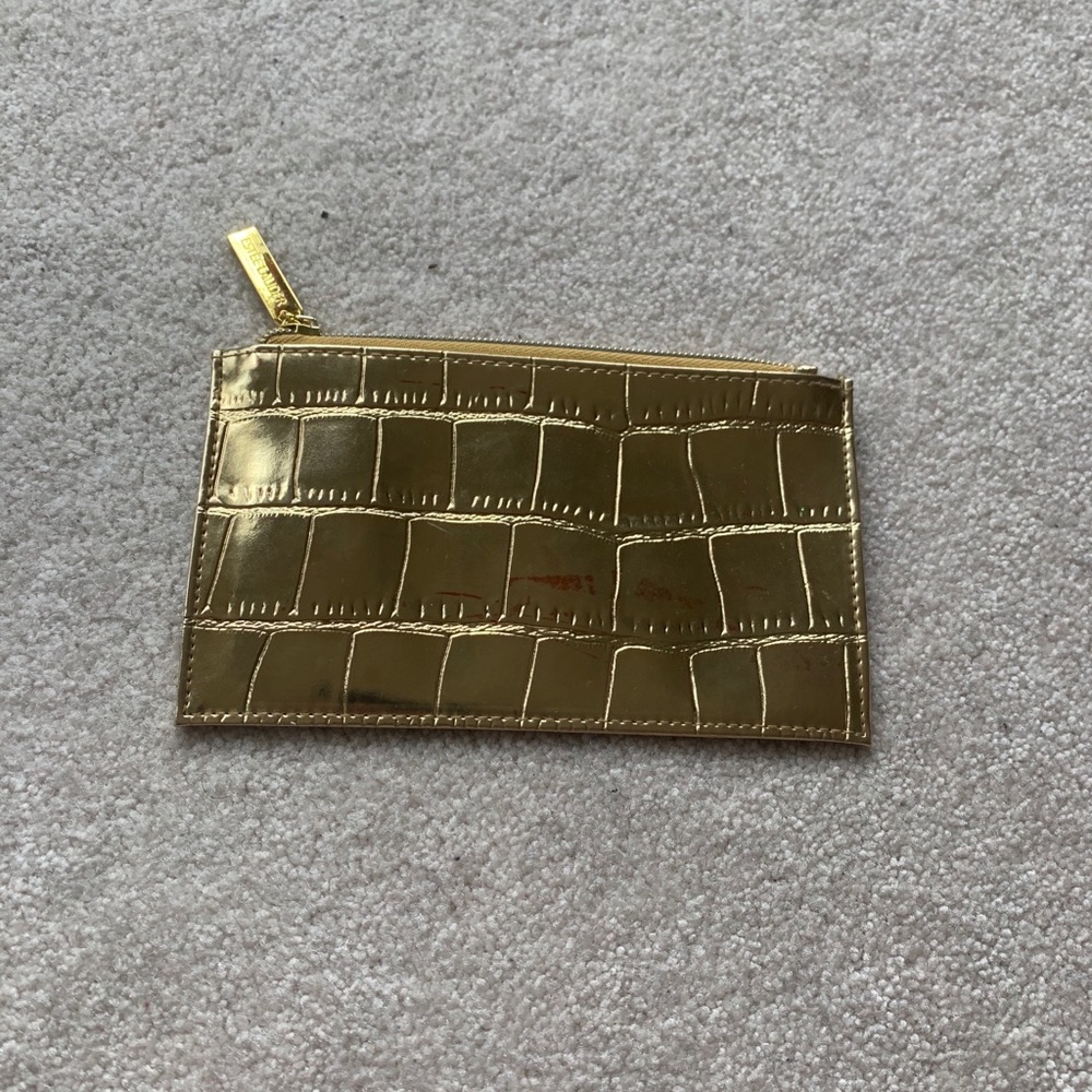 Rigid gold cosmetic bag